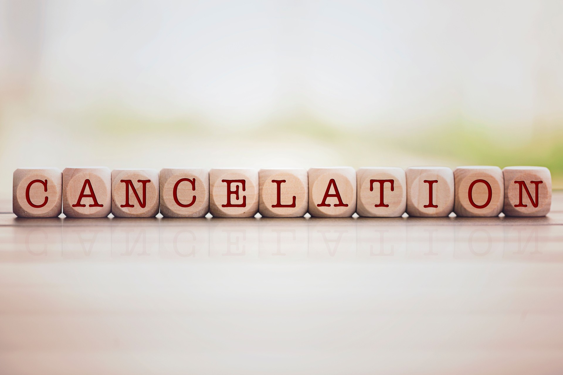 Cancelation written on cube wooden blocks.